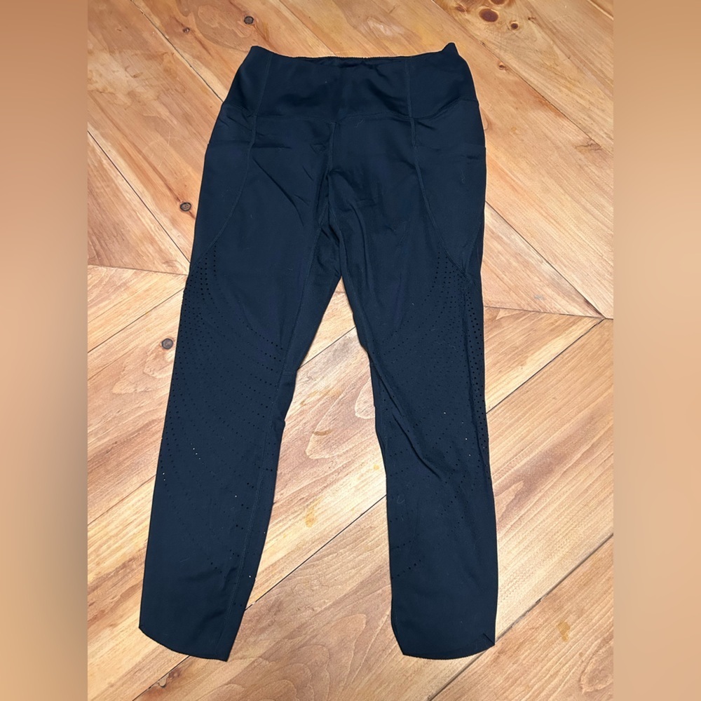 Women's Black Leggings size Medium with pockets and cut out design